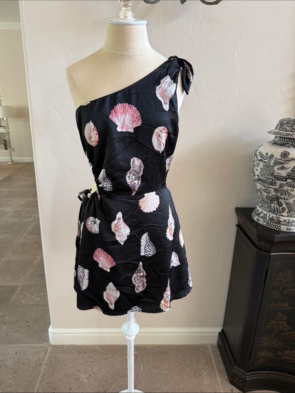 Show me your mumu seashell black mini dress with side cut out. XS